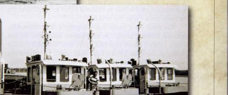 Three U.S. Army Corps of Engineers steel tugs built by Roamer, rafted together on the Mississippi River